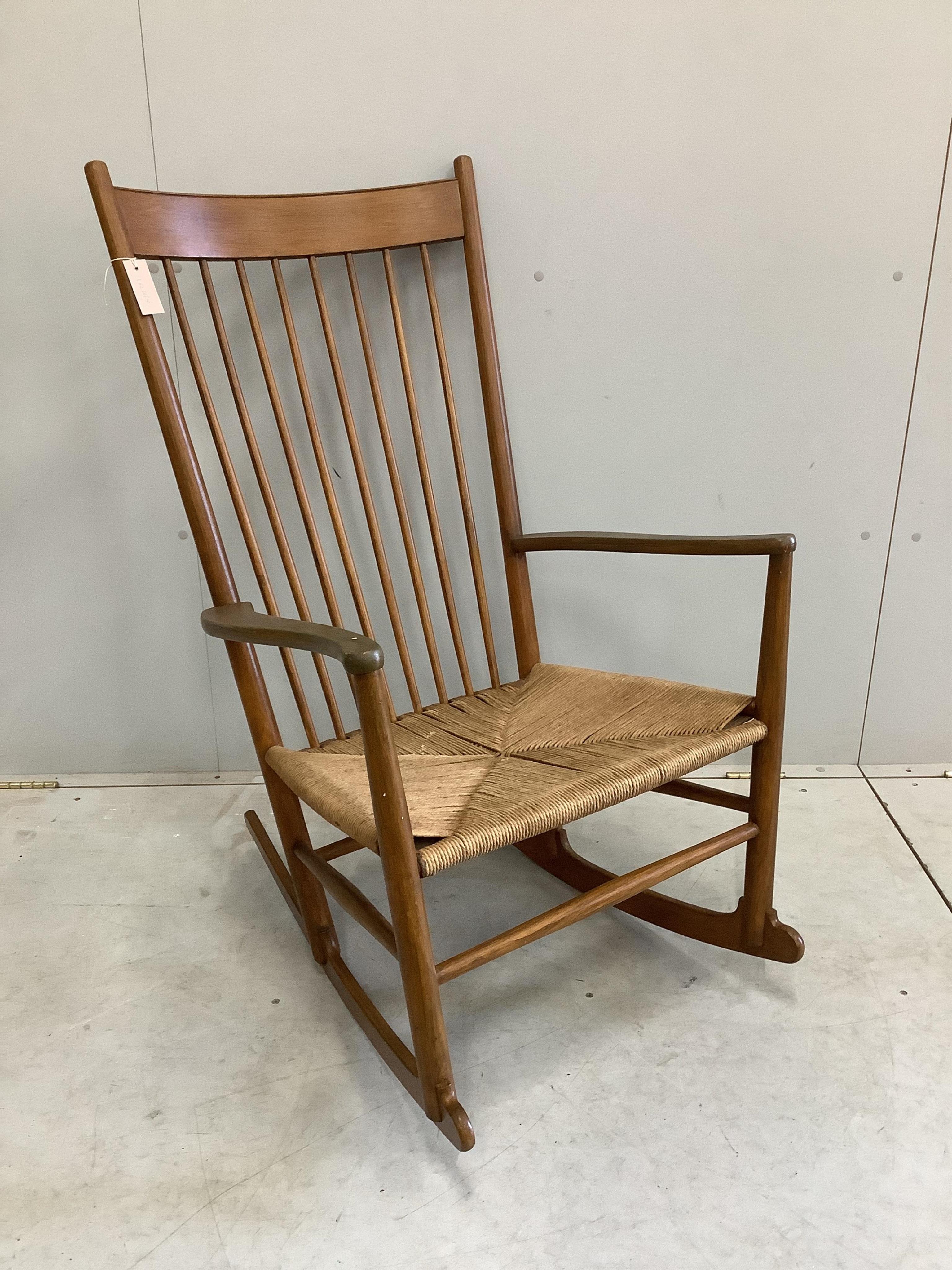 A Hans Wegner style rocking chair, width 63cm, height 106cm. Condition - fair